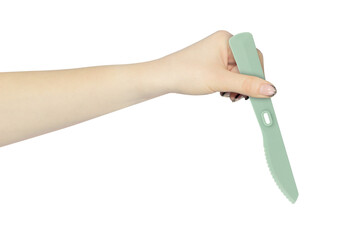 plastic knife in hand, outstretched hand with plastic knife isolated from background