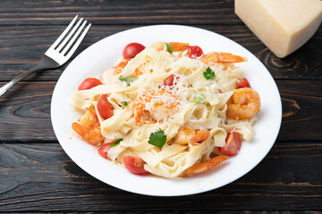 Italian pasta with shrimps , parmesan and tomatoes