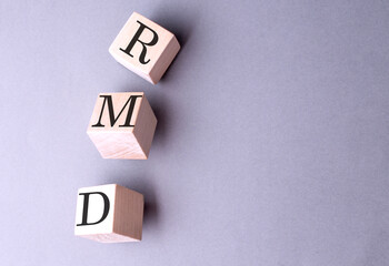 RMD word on wooden block on gray background