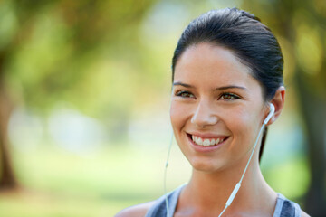 Woman, earphones and music for fitness in park, closeup and audio inspiration for training in...