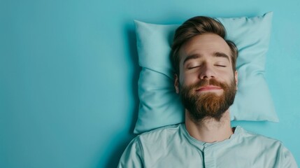 a young man sleeping on pillow isolated on pastel blue colored background Sleep deeply peacefully...