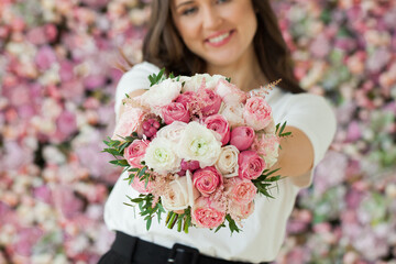 Pink and white flower bouquet in hand close up - 763178981