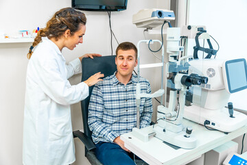 Adult talking to specialist in a visit at the ophthalmologist