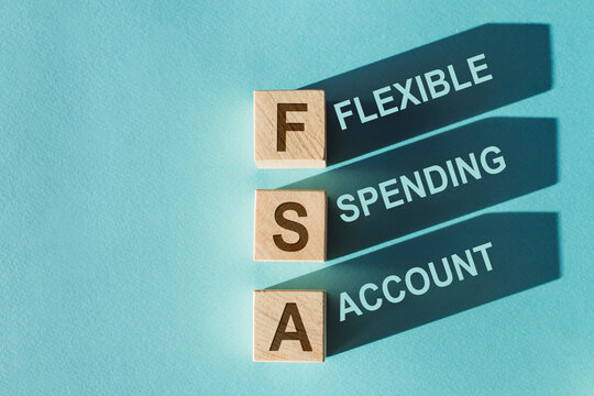Three wooden cubes with letters FSA