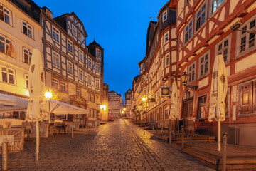 Fototapeta na wymiar Night medieval street with traditional half-timbered houses, Marburg an der Lahn, Hesse, Germany