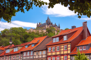 Medieval street with half-timbered houses and castle in Wernigerode, Saxony-Anhalt, Germany - 763192945