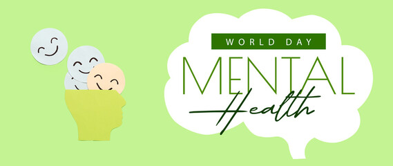Happy smile faces with paper human head on green background. Mental Health Day