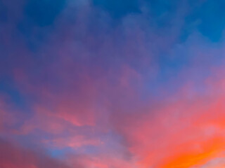 Dramatic sunset sky with colorful clouds background concept. Evening sunset. Beautiful red and orange twilight sky.