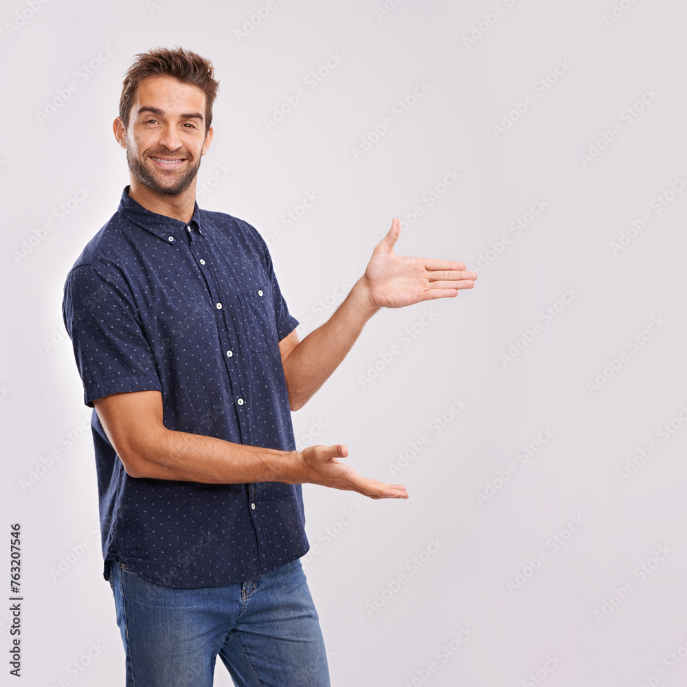 Poster happy man, studio and portrait with pointing to mockup and hand gesture for sign or advertising. mod