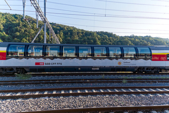 Close-up of Gotthard Panorama Express train at railway station of Chiasso on a sunny summer evening. Photo taken August 11th, 2023, Chiasso, Switzerland.