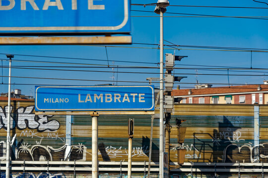 Blue signs at railway station Milan Lambrate at Italian City of Milano on a sunny summer day. Photo taken August 11th, 2023, Milan, Italy.