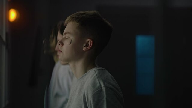 African American jailer talks to diverse young prisoners, then leads them to prison cell. Teenage inmates, criminals serve imprisonment terms in jail. Youth detention center or correctional facility