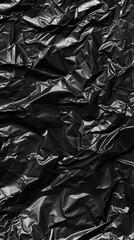 Close-Up View of Crumpled Black Material Highlighting Tactile Textures