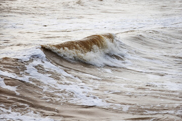 Waves on a sandy beach during a storm on the Black Sea