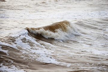 Waves on a sandy beach during a storm on the Black Sea - 763215555