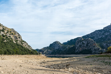The cuber reservoir in Majorca during high drought in summer with the water level falling sharply - 763221984