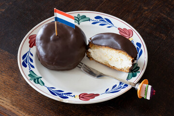 Bossche Bol decorated with dutch flag, typical dutch pastry consisting of chocolate coated ball...