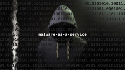 Cyber attack malware-as-a-service text in foreground screen, anonymous hacker hidden with hoodie in the blurred background. Vulnerability text in binary system code on editor program. - obrazy, fototapety, plakaty