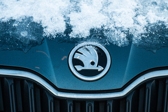 Gothenburg, Sweden - January 06 2024: Skoda car logo with ice on a car.