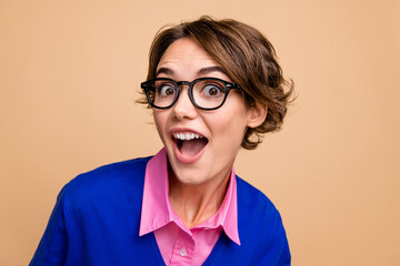 Photo portrait of pretty young girl open mouth excited face wear trendy blue outfit isolated on beige color background