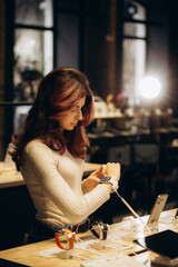 Shopping a new digital device. Happy beautiful woman choosing a smart watch in tech store