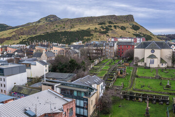 Kirk of the Canongate, cemetery and Holyrood Park in Edinburgh city, Scotland, UK