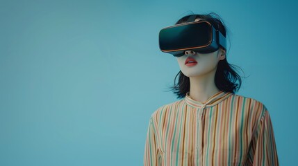 A woman wearing a VR headset against a blue background with copy-space. The immersive experience offered by VR technology - 763246131