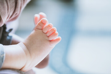 Close up of newborn baby feet, shallow depth of field, vintage tone