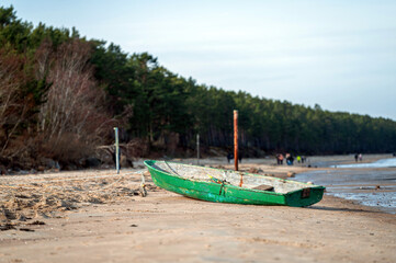 Naklejka na ściany i meble fishing boat on the beach of Baltic Sea, Latvia