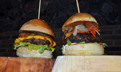 some gourmet hamburgers on a restaurant table