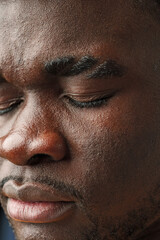 Obraz premium Close Up of African Mans Face With Brown Eyes