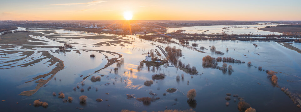 Aerial view of Church of the Intercession on the Nerl surrounded by flooded Nerl river and beautiful Russian landscape, Bogolyubovskoe, Vladimir, Russia.