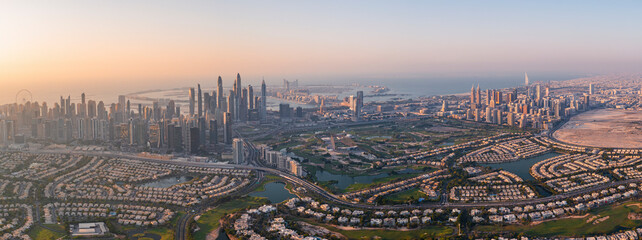 Aerial view of Dubai Marina and Jumeirah Lake Towers with the stunning skyline and skyscrapers of Dubai, United Arab Emirates.