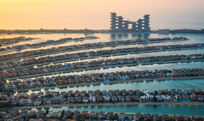 Aerial view of the luxurious Atlantis the Royal resort and Palm Jumeirah island at twilight, Dubai, United Arab Emirates.