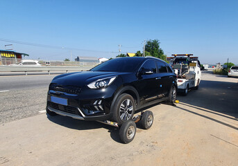 Tow Truck Towing a flat tire electric car