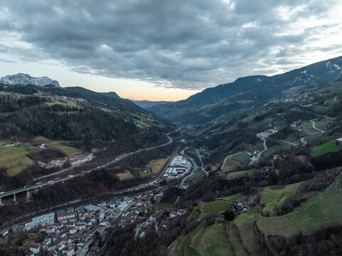 Aerial view of picturesque village with winding road, Klausen, South Tyrol, Italy.