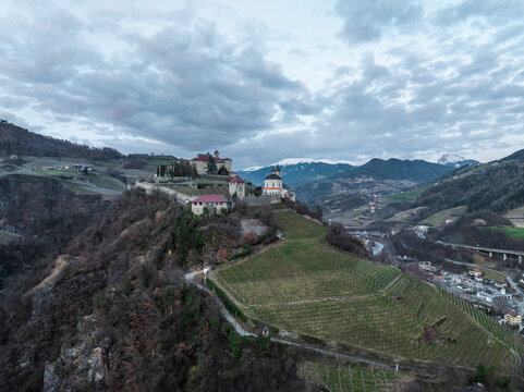 Aerial view of Sabiona Monastery and Chiusa town, Klausen, South Tyrol, Italy.