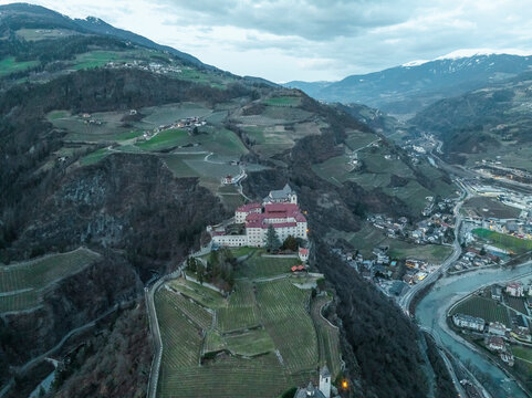 Aerial view of Sabiona Monastery and charming town of Klausen, South Tyrol, Italy.
