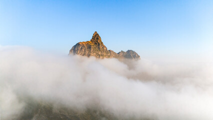 Aerial drone view of mountain peaks in morning light covered by clouds, Santo Antao island, Cape Verde.