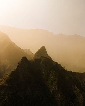 Aerial drone view of mountain peaks during Sahara sandstorm, wide panorama on Santo Antao island, Cape Verde.