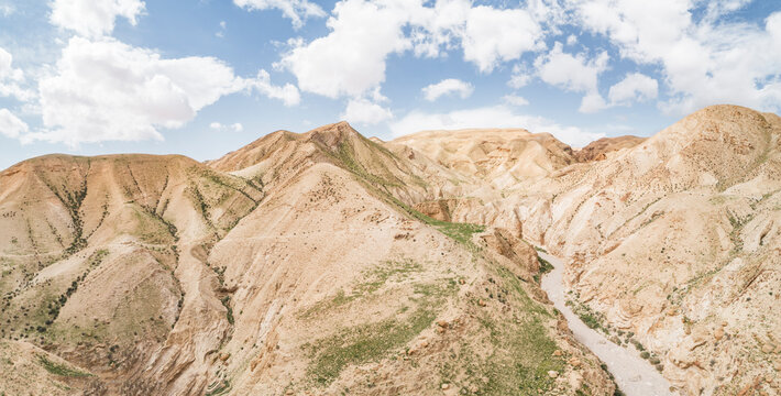 Aerial view of desert hills and rocky terrain in Jericho Governorate, Palestine.