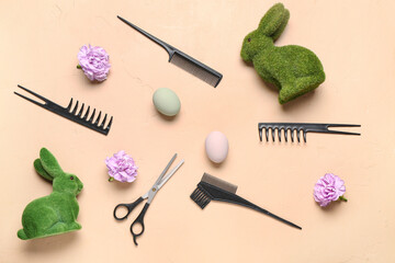 Hairdressing accessories with flowers, Easter eggs and bunnies on beige background