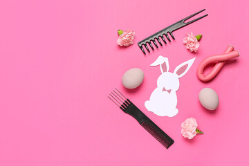 Hairdressing accessories with flowers, Ester eggs and bunny on pink background