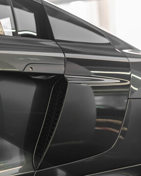 Grey Audi R8 V10 2015 year model carbon fiber side blade on air intake - High Resolution Image