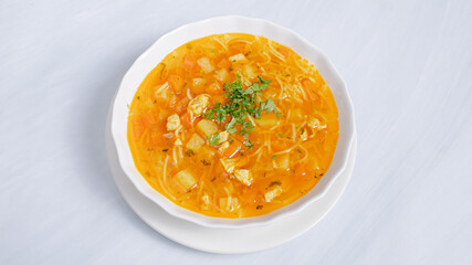 Bowl of chicken soup with vermicelli isolated on white