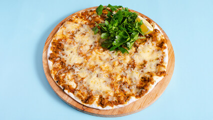 Meat and cheese lahmacun top view