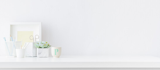 Fototapeta na wymiar Bright stylish and minimal workspace. White desk with empty space. 