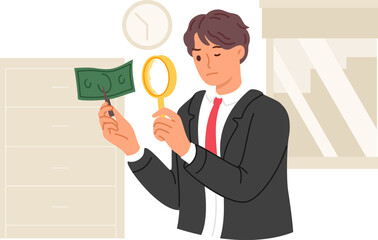 Expert examines counterfeit dollar money by using magnifying glass to look for inaccuracies in fake banknotes. Fake money printed by criminal in hands of inspector investigating crime