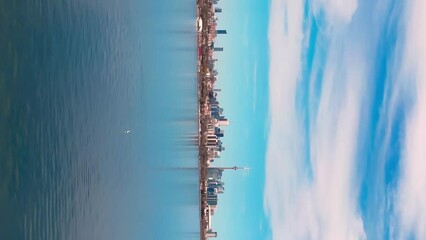 Toronto Canada Northern America Lake Ontario majesty vertical video aerial view Northern America tranquil lakeside urban elegance. Northern America Toronto's pristine nature serene beauty.