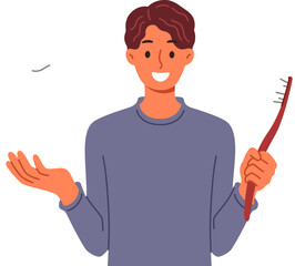 Man recommends brushing teeth well using right toothbrush to prevent caries. Guy is reminded of importance of oral hygiene and preventative control of caries by showing giant crown and brush